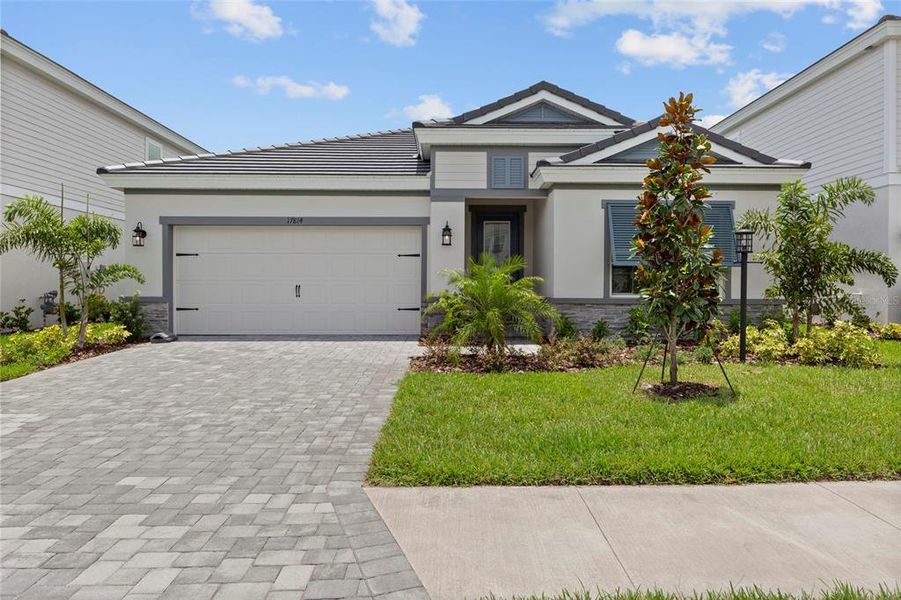 Front exterior of a new home in , Bradenton, FL, highlighting curb appeal (Image 26). Front exterior of a new home in , Bradenton, FL, highlighting curb appeal (Image 26).