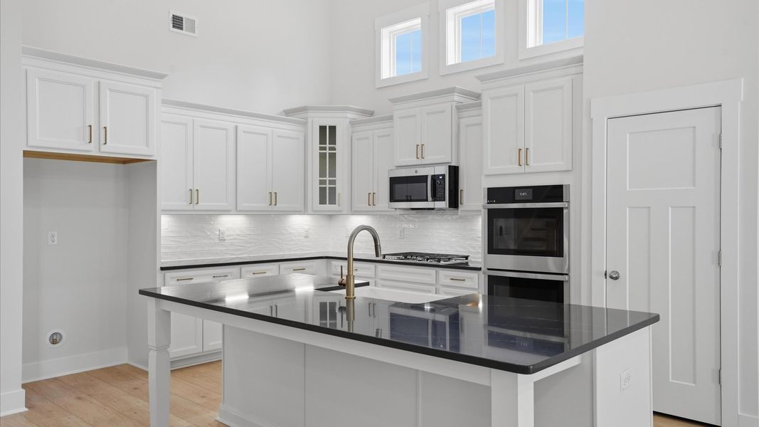 Accomplished layout with a first-class kitchen in this select community by DRB Homes