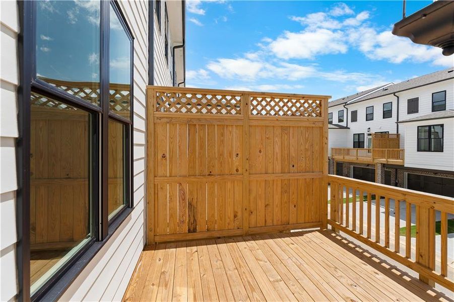 Exterior details and patio area of a home in Millcroft Townhomes, Buford (Image 20).