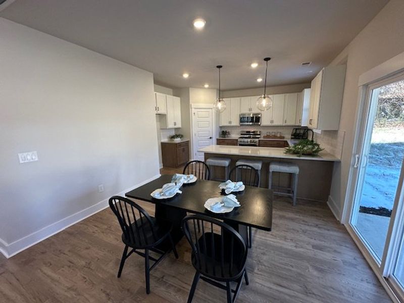 This open concept dining area and kitchen features