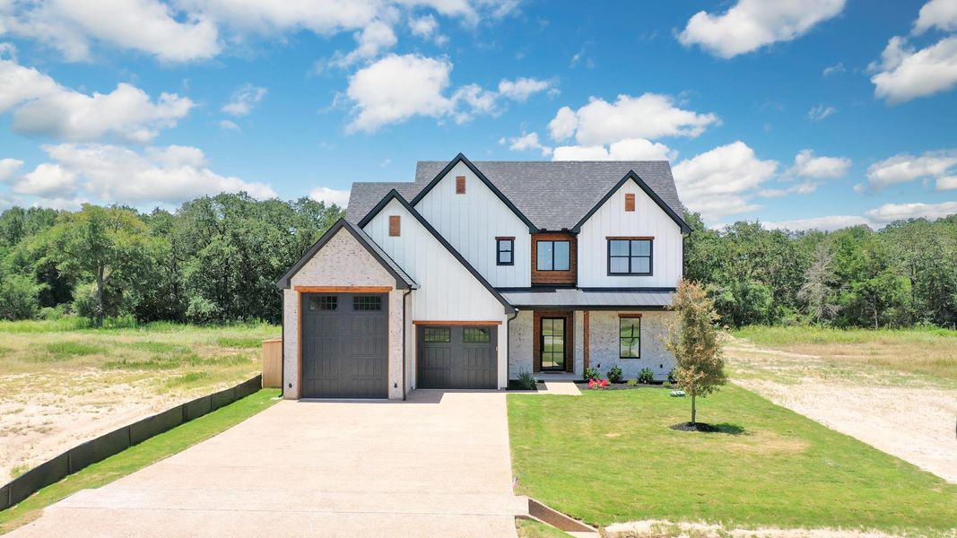 Front exterior of a new home in , Somerville, TX, highlighting curb appeal (Image 24). Front exterior of a new home in , Somerville, TX, highlighting curb appeal (Image 24).