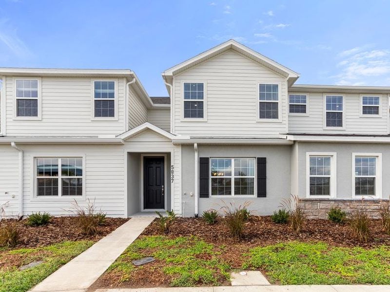 The Flora offers 1,705 sq ft of living space with beautiful curb appeal.