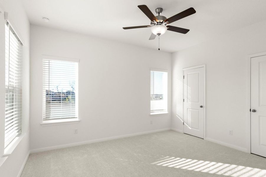 Unfurnished bedroom featuring ceiling fan, light colored carpet, and a closet