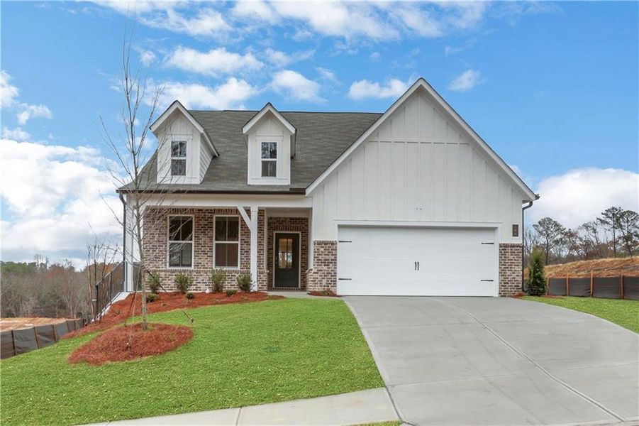 Front exterior of a new home in Cambridge at Steels Bridge, Canton, GA, highlighting curb appeal (Image 24). Front exterior of a new home in Cambridge at Steels Bridge, Canton, GA, highlighting curb appeal (Image 24).