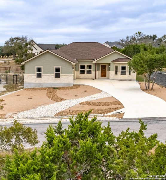 Front exterior of a new home in , Blanco, TX, highlighting curb appeal (Image 21). Front exterior of a new home in , Blanco, TX, highlighting curb appeal (Image 21).