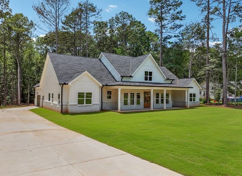 Front exterior of a new home in , Monroe, GA, highlighting curb appeal (Image 2). Front exterior of a new home in , Monroe, GA, highlighting curb appeal (Image 2).