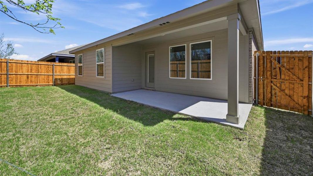 Exterior details and patio area of a home in Sweetwater Springs, Sherman (Image 3).