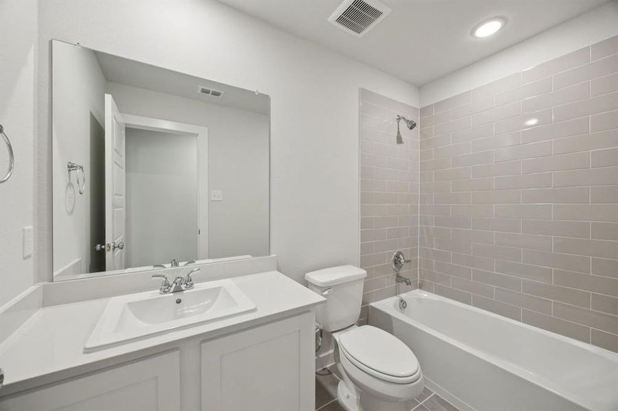 Bathroom in the Hadley home plan by Trophy Signature Homes – REPRESENTATIVE PHOTO Bathroom in the Hadley home plan by Trophy Signature Homes – REPRESENTATIVE PHOTO