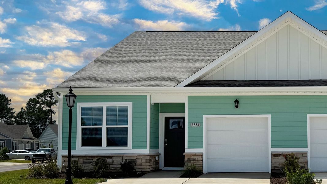 Representative exterior photo of a completed home built from the Belmont by D.R. Horton in Brunswick Plantation, Ash, NC (Image 21). Representative exterior photo of a completed home built from the Belmont by D.R. Horton in Brunswick Plantation, Ash, NC (Image 21).