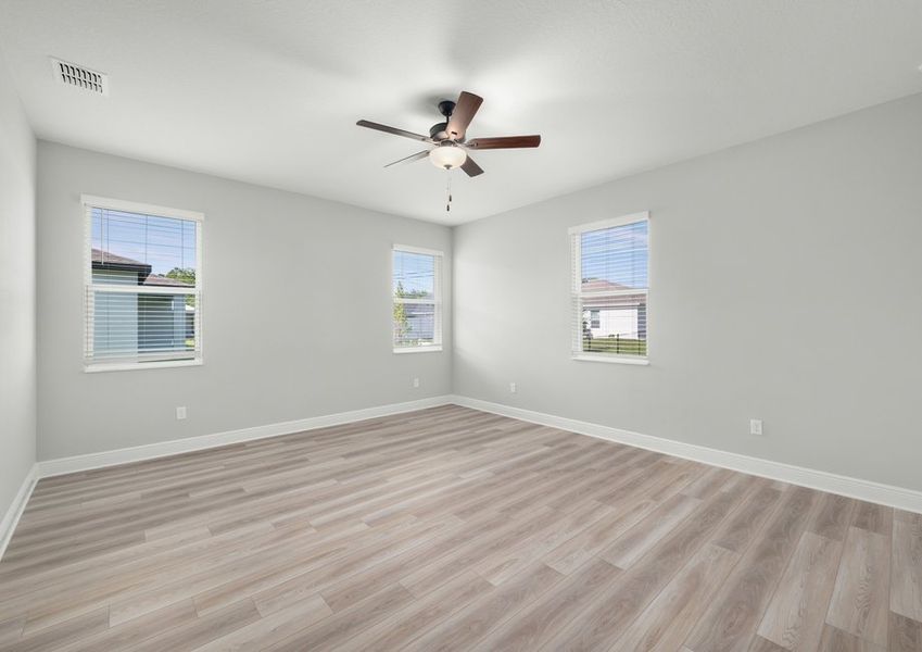 The master bedroom has ample natural light and room for your king-sized furniture