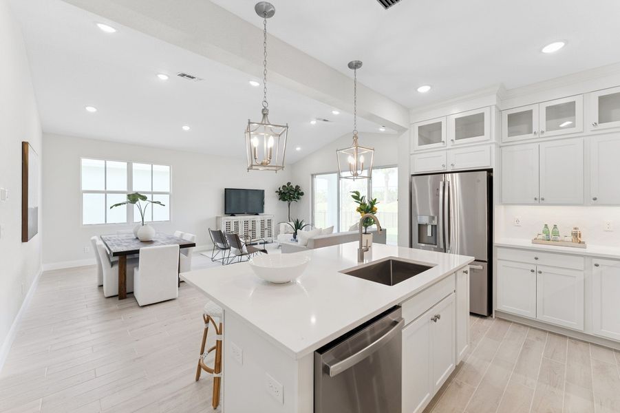 Open concept living spaces with vaulted ceiling