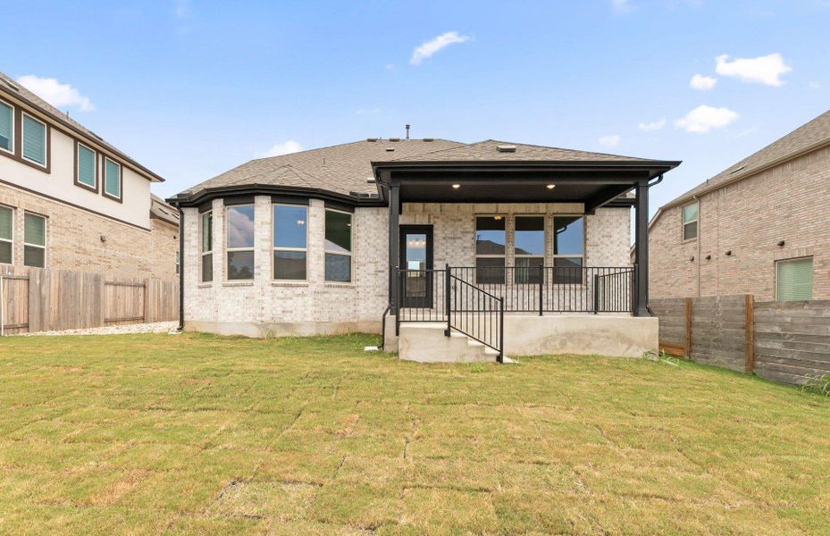 Exterior details and patio area of a home in Bluffview Reserve, Leander (Image 28).