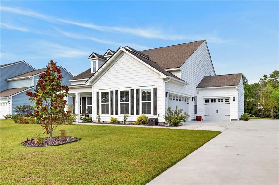 Front exterior of a new home in , Richmond Hill, GA, highlighting curb appeal (Image 28). Front exterior of a new home in , Richmond Hill, GA, highlighting curb appeal (Image 28).