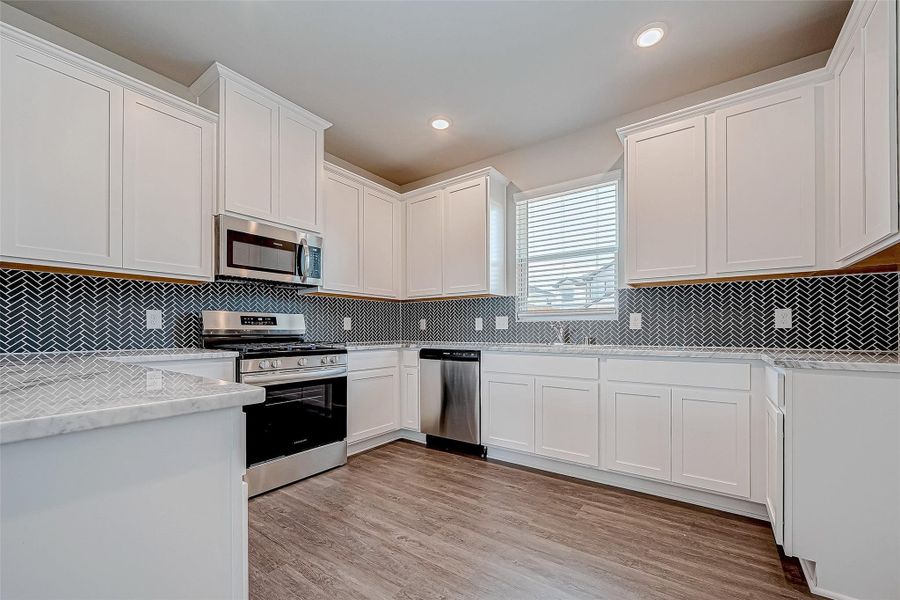 Furnished interior view inside a new home in Mill Creek Trails, Magnolia (Image 6).