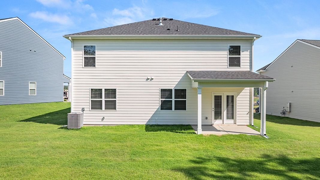 Exterior details and patio area of a home in Estates at Deer Hollow, Grovetown (Image 24).