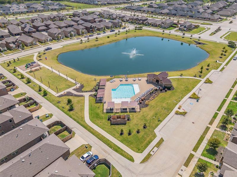 Aerial overview of property's location featuring nearby suburban area and a nearby body of water Aerial overview of property's location featuring nearby suburban area and a nearby body of water