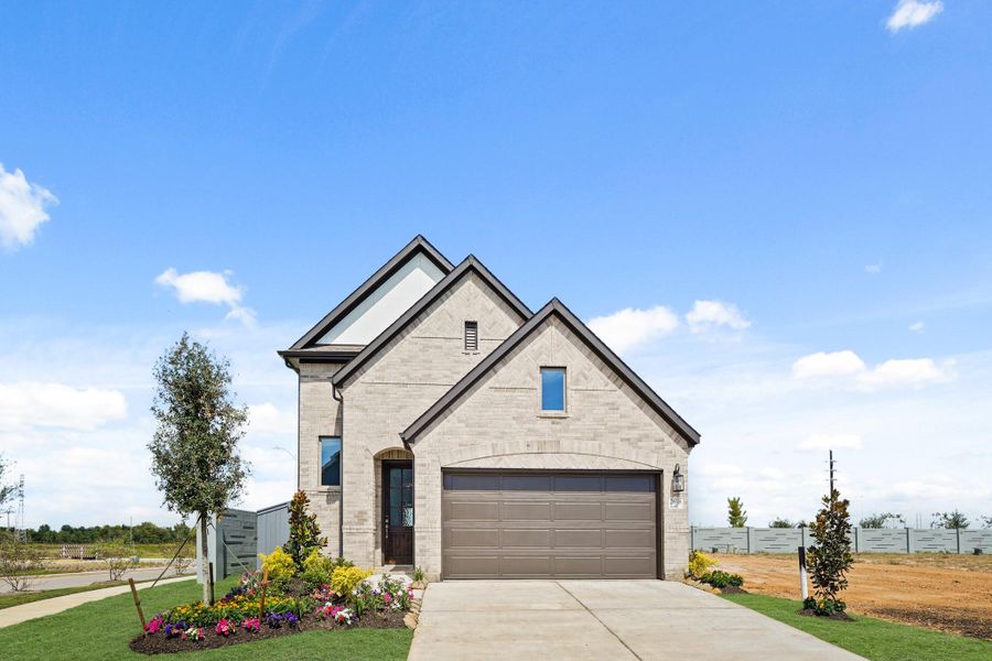 Front exterior of a new home in Jubilee 40', Hockley, TX, highlighting curb appeal (Image 20). Front exterior of a new home in Jubilee 40', Hockley, TX, highlighting curb appeal (Image 20).