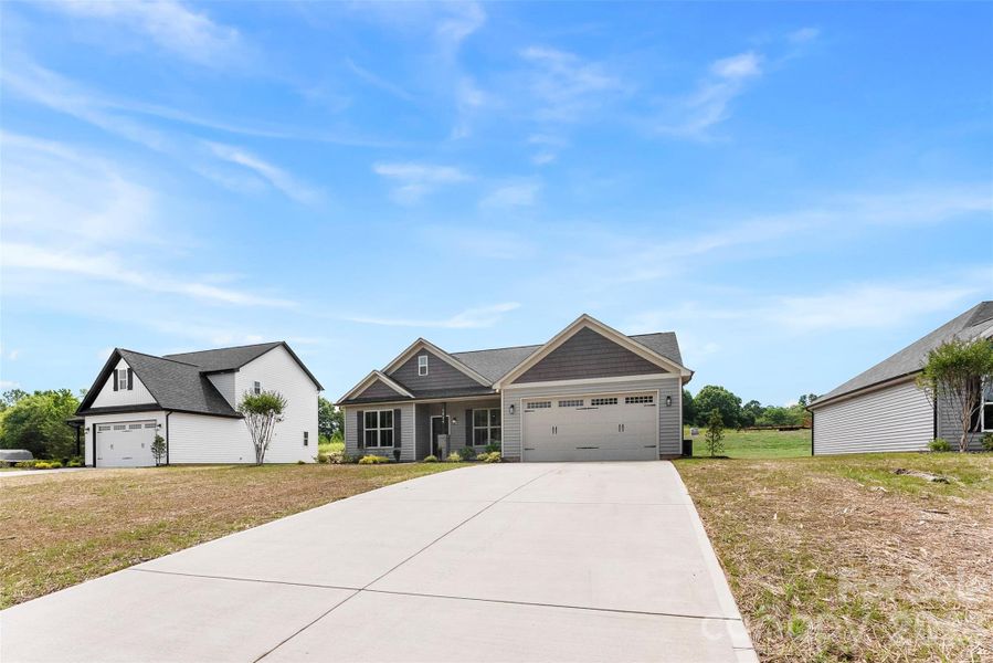 Front exterior of a new home in , Albemarle, NC, highlighting curb appeal (Image 27).