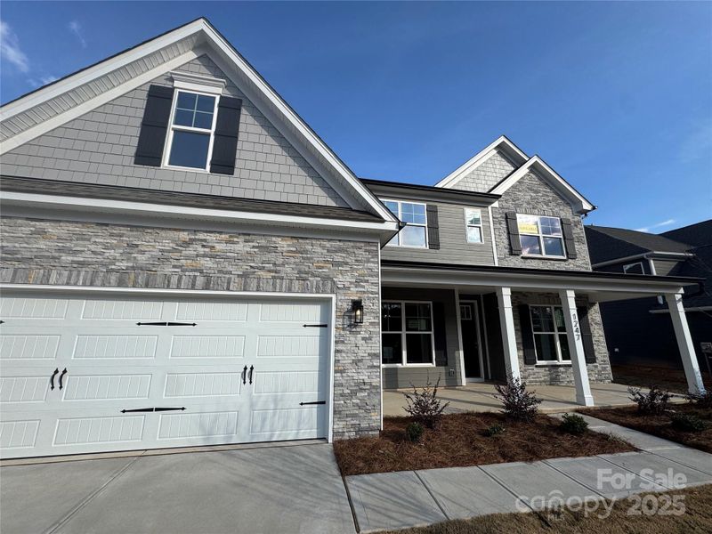 Front exterior of a new home in Carrington, Stanley, NC, highlighting curb appeal (Image 2).