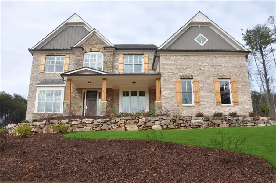Front exterior of a new home in , Cumming, GA, highlighting curb appeal (Image 1). Front exterior of a new home in , Cumming, GA, highlighting curb appeal (Image 1).