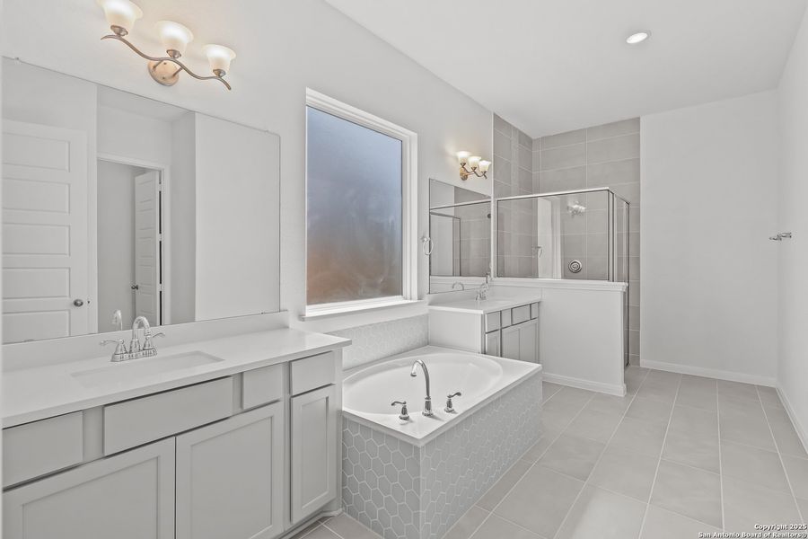 Furnished interior view inside a new home in Homestead 65', Schertz (Image 11).