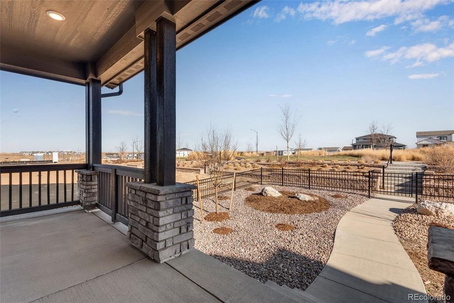 Exterior details and patio area of a home in Crescendo at The Aurora Highlands, Aurora (Image 31).