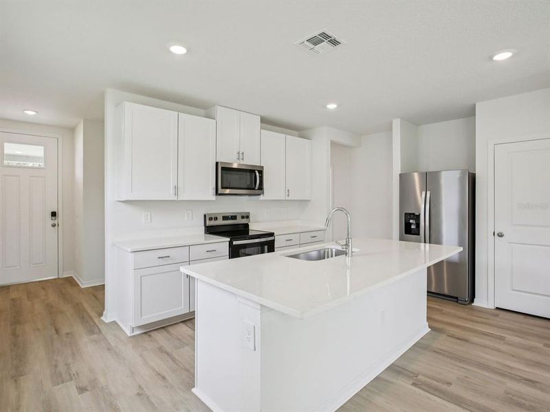 Furnished interior view inside a new home in The Grove at Stuart Crossing - Premier Series, Bartow (Image 7).