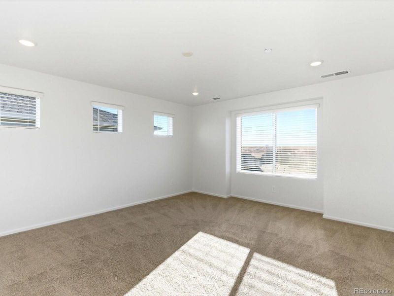 Spacious, unfurnished interior of a new home in Buffalo Highlands: The Flora Collection, Commerce City (Image 16).