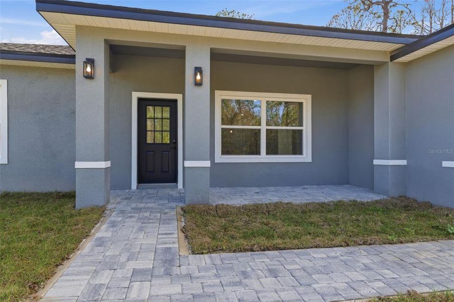 Exterior details and patio area of a home in , Citrus Springs (Image 21).
