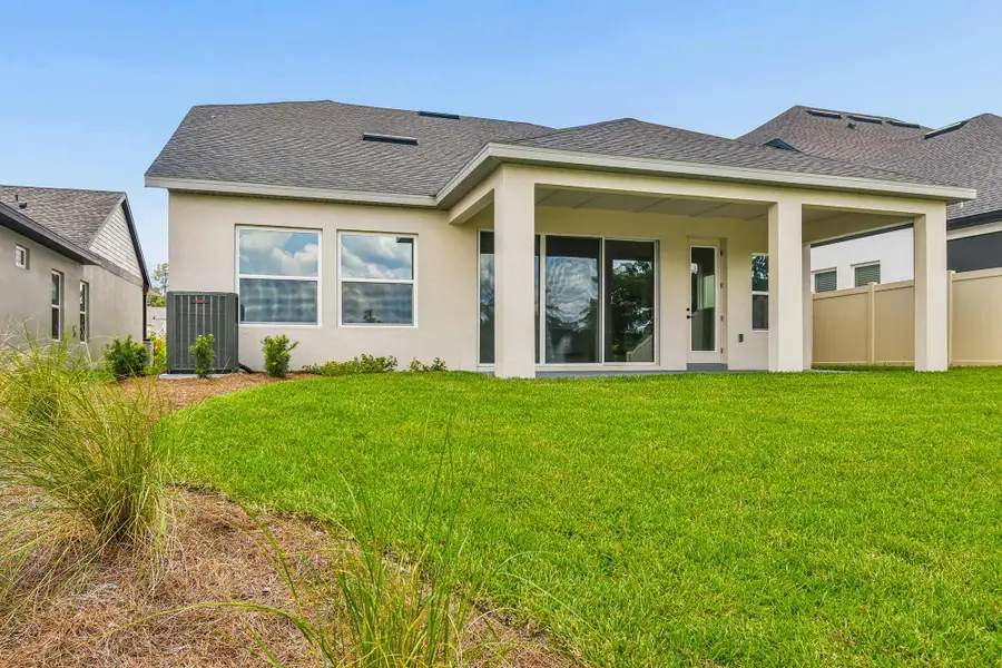 Representative exterior details of a home built from the The Collins by David Weekley Homes in Palmeras at Crossprairie – The Grove Collection, St. Cloud (Image 4).