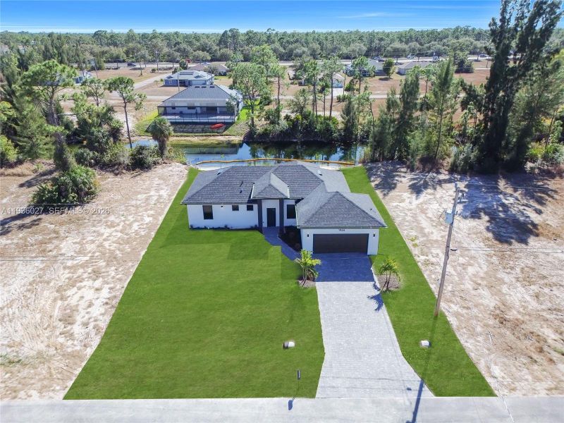Front exterior of a new home in , Cape Coral, FL, highlighting curb appeal (Image 21).
