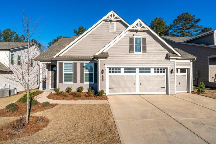 Front exterior of a new home in , Hoschton, GA, highlighting curb appeal (Image 26).
