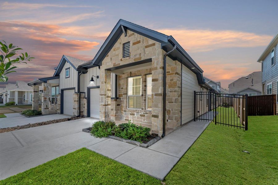 Exterior details and patio area of a home in Meridiana, Manvel (Image 15).