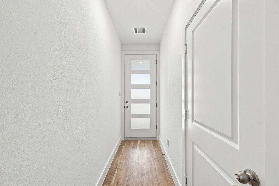 Welcoming interior entry with modern finishes and natural light. Welcoming interior entry with modern finishes and natural light.