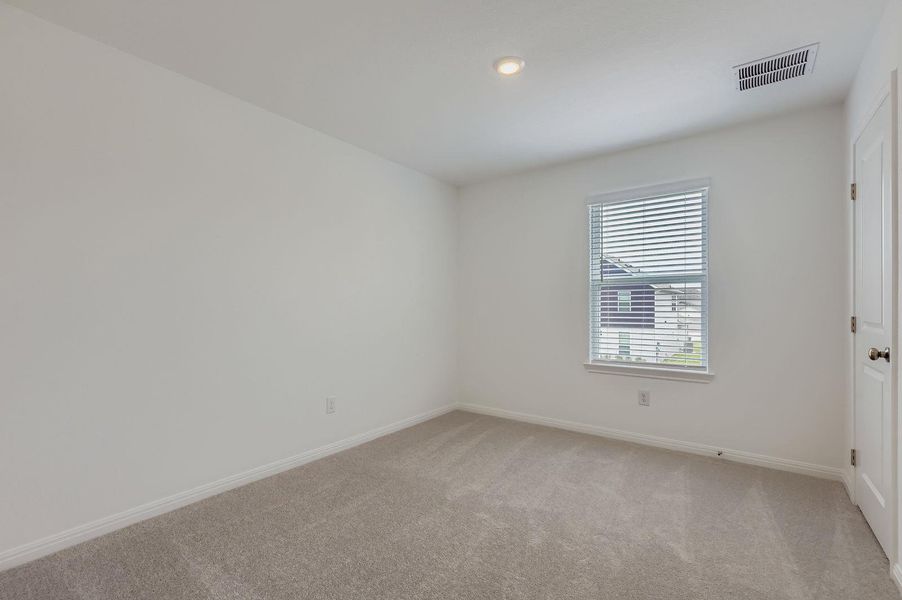 Empty room with light colored carpet and recessed lighting Empty room with light colored carpet and recessed lighting