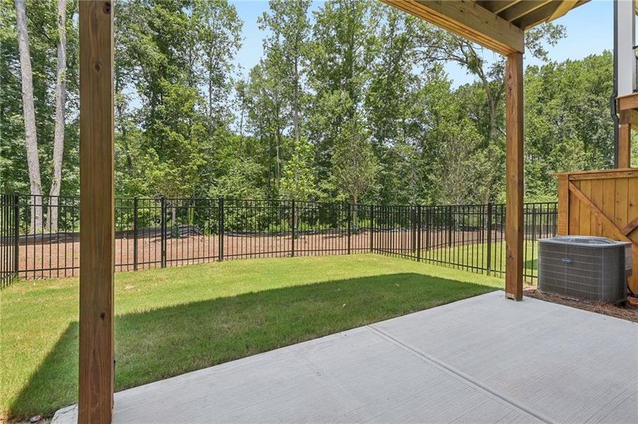 Exterior details and patio area of a home in Waterside Townhomes, Peachtree Corners (Image 18).