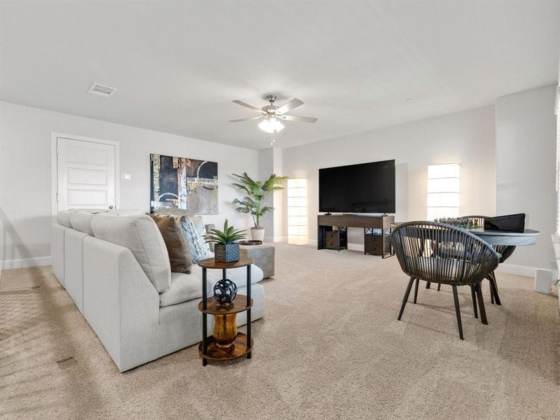 Ascend to a massive, highly versatile third-floor loft space currently configured as a premium media and game room.
