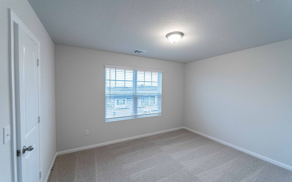 Spacious, unfurnished interior of a new home in Brooklands, Hutto (Image 14).