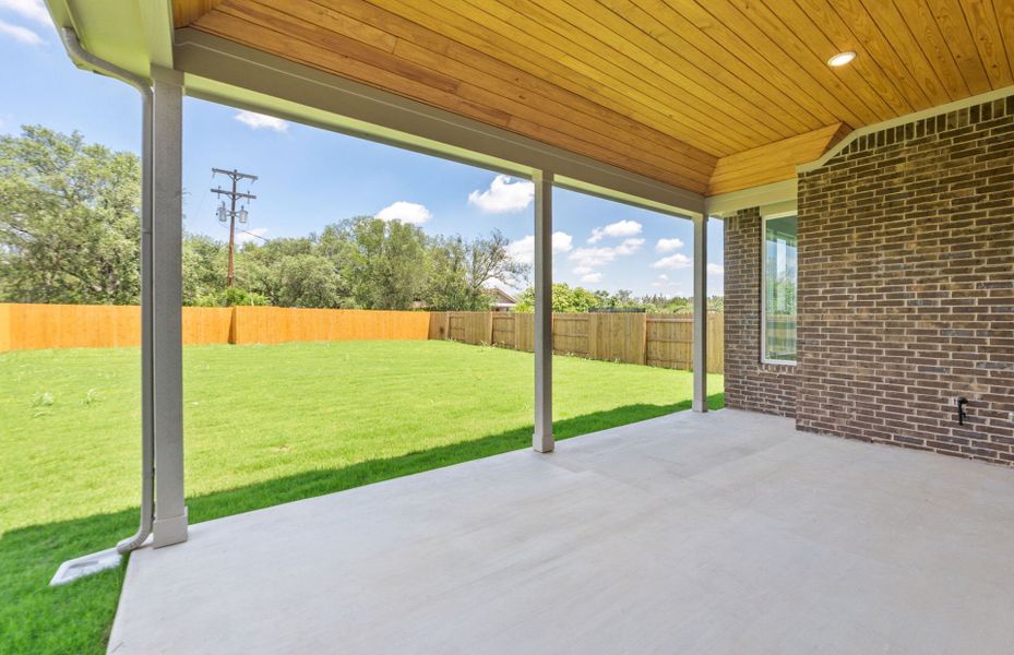 Exterior details and patio area of a home in 6 Creeks, Kyle (Image 27).