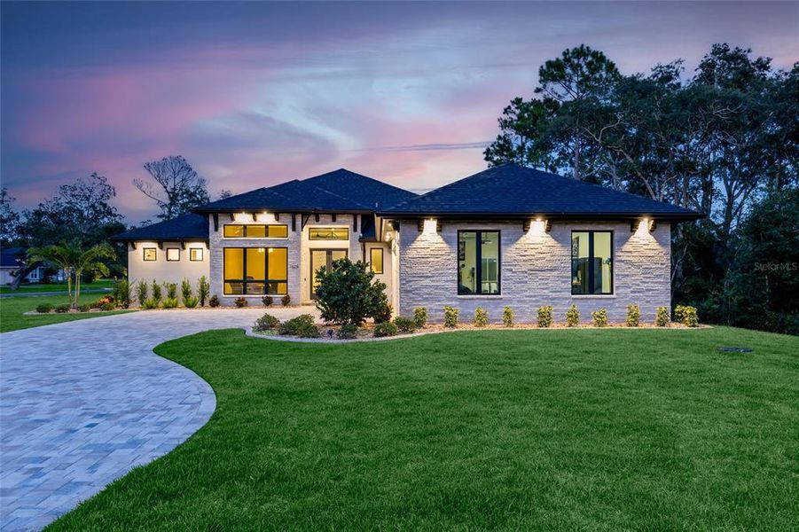 Front exterior of a new home in , New Smyrna Beach, FL, highlighting curb appeal (Image 20). Front exterior of a new home in , New Smyrna Beach, FL, highlighting curb appeal (Image 20).