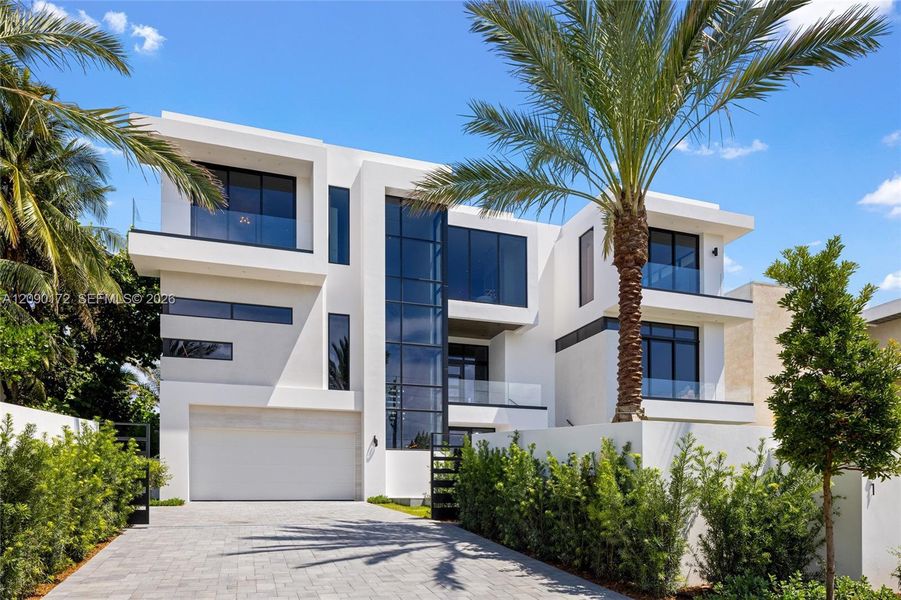 Front exterior of a new home in , Hillsboro Beach, FL, highlighting curb appeal (Image 1). Front exterior of a new home in , Hillsboro Beach, FL, highlighting curb appeal (Image 1).
