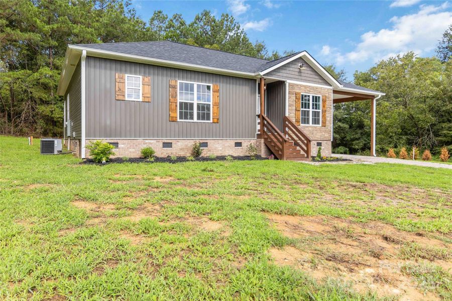 Front exterior of a new home in , Chester, SC, highlighting curb appeal (Image 1).