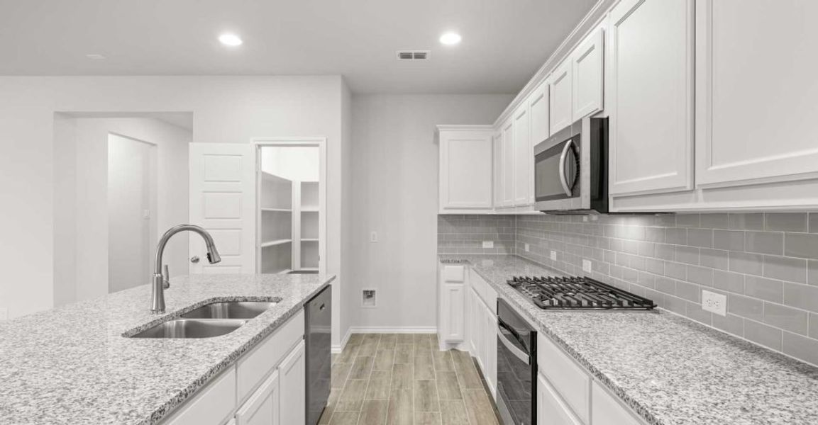 Representative exterior photo of a completed home built from the Dozier by Impression Homes in Redden Farms, Midlothian, TX (Image 9). Representative exterior photo of a completed home built from the Dozier by Impression Homes in Redden Farms, Midlothian, TX (Image 9).