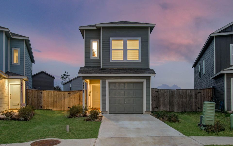 Front exterior of a new home in , New Caney, TX, highlighting curb appeal (Image 23). Front exterior of a new home in , New Caney, TX, highlighting curb appeal (Image 23).