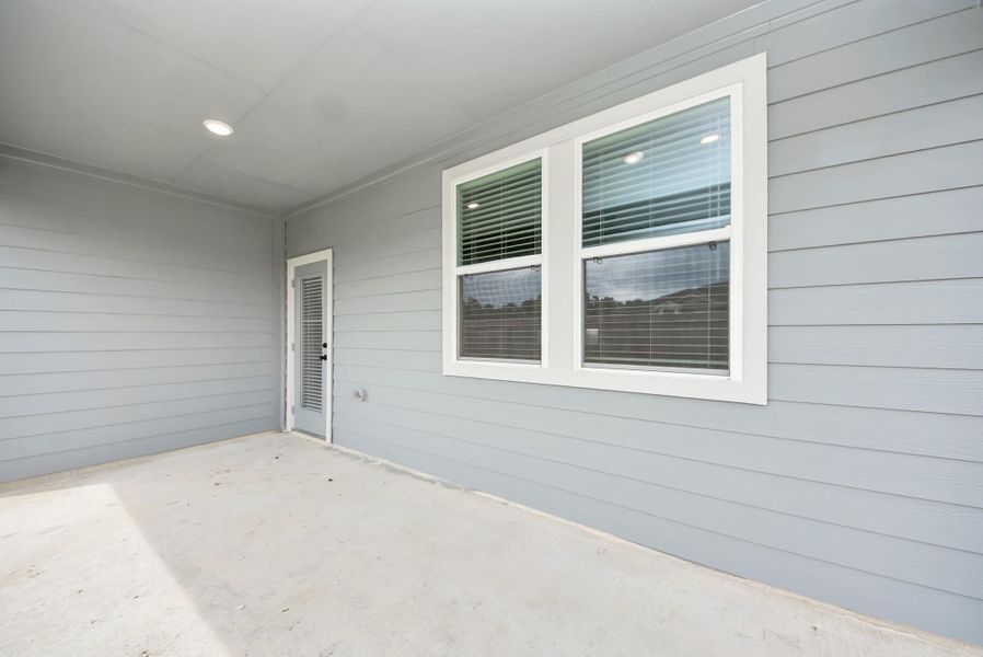 Exterior details and patio area of a home in Enclave at Newport, Crosby (Image 3).