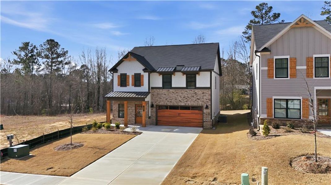 Front exterior of a new home in Meadow Pines, Dallas, GA, highlighting curb appeal (Image 23).