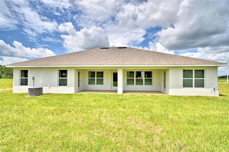 Exterior details and patio area of a home in Cadence Crossing, Auburndale (Image 24).