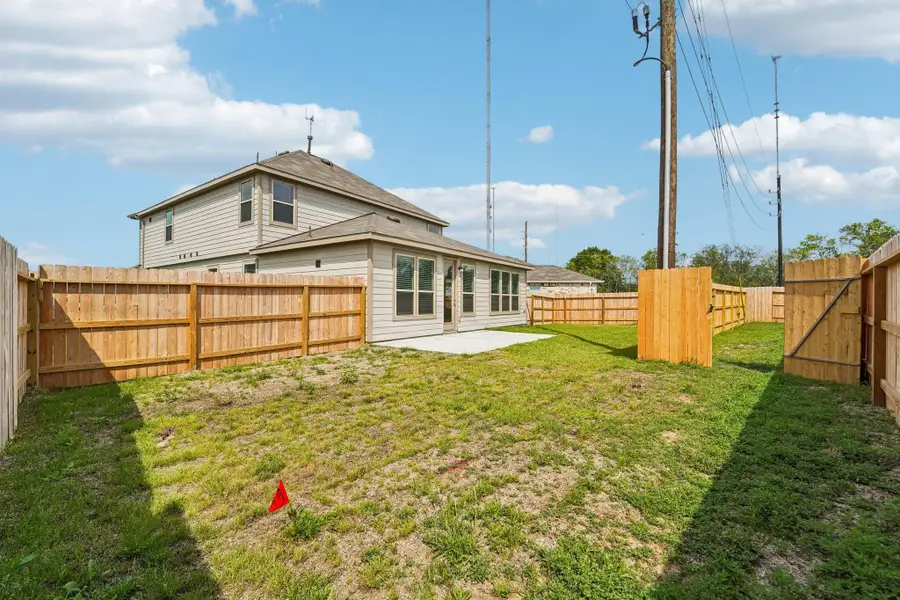 Views of the backyard green space and fully fenced yard.