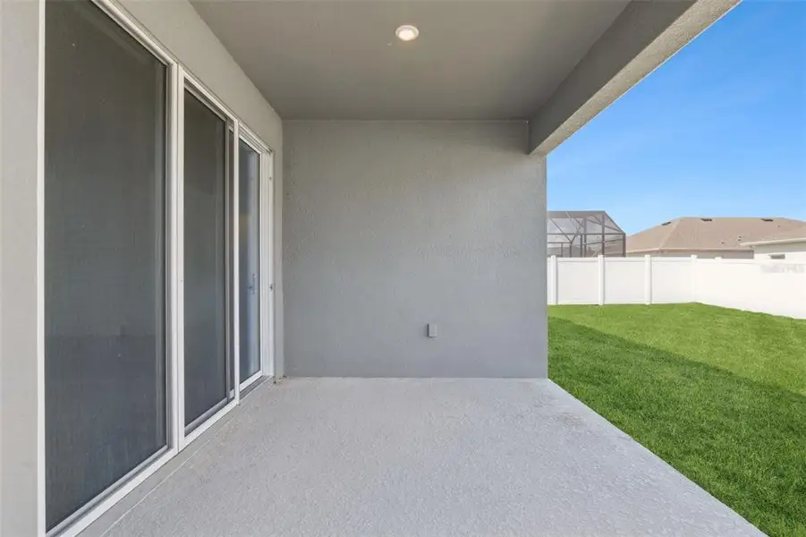 Exterior details and patio area of a home in Prairie Oaks, St. Cloud (Image 2).