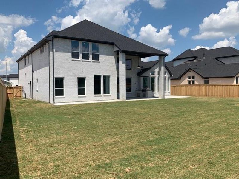 Exterior details and patio area of a home in Dunham Pointe, Cypress (Image 22).